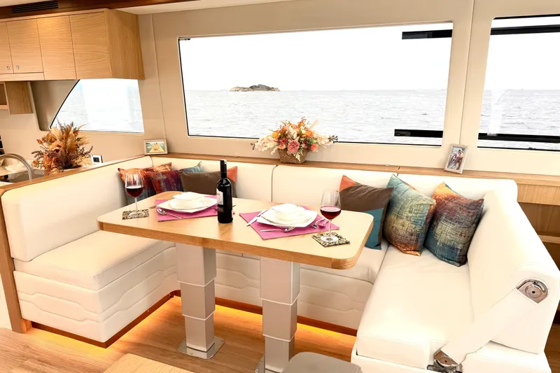  Yacht Photos Pics Luxurious interior of 2025 Altima Express Coupe 65 yacht with elegant dining setup.
