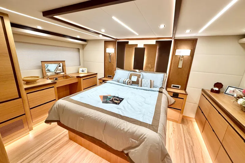  Yacht Photos Pics Luxurious bedroom interior of 2025 Altima Express Coupe 65 yacht, featuring elegant wood finishes.