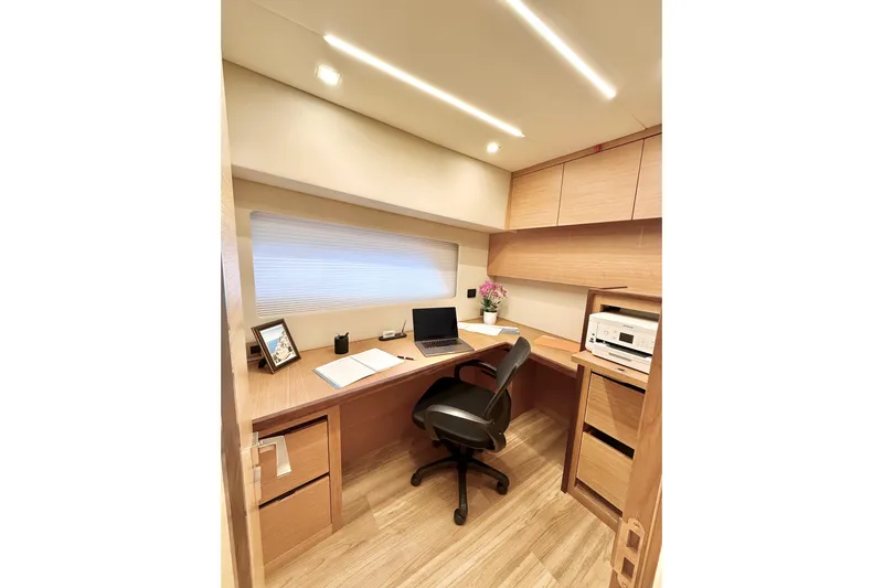  Yacht Photos Pics Modern office space inside 2025 Altima Express Coupe 65, featuring sleek design and efficient layout.