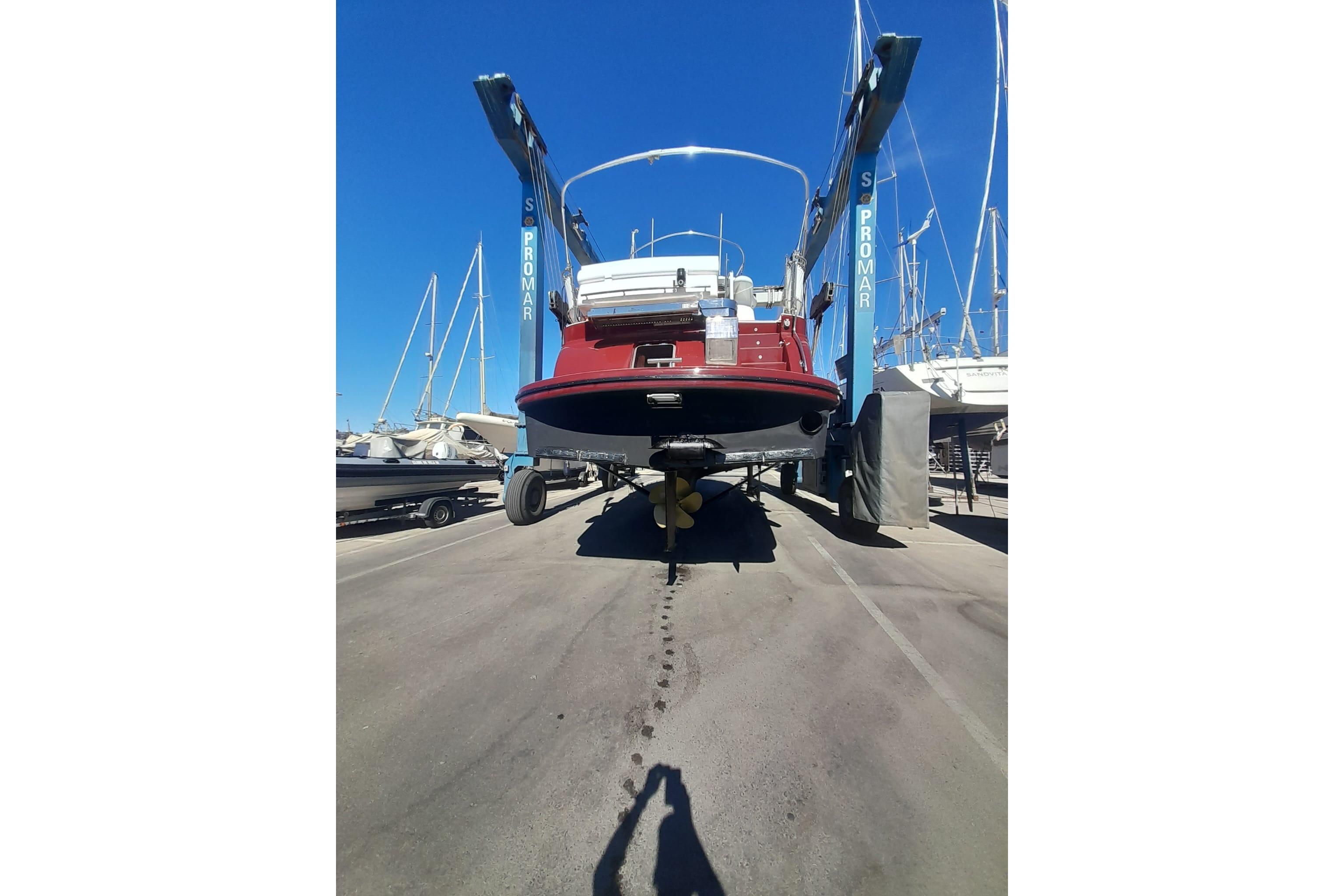 2014 Elling E3 Ultimate yacht in dry dock, rear view, under clear blue sky.