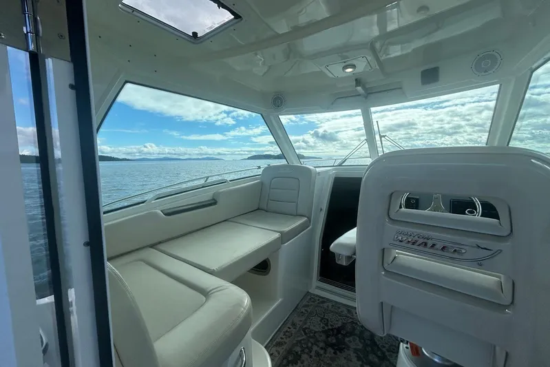  Yacht Photos Pics Interior of 2016 Boston Whaler 315 Conquest Pilothouse with ocean view.