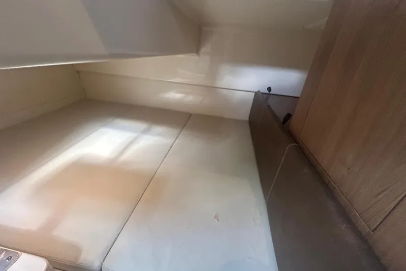  Yacht Photos Pics Interior cabin of 2016 Boston Whaler 315 Conquest Pilothouse, featuring cushioned seating.