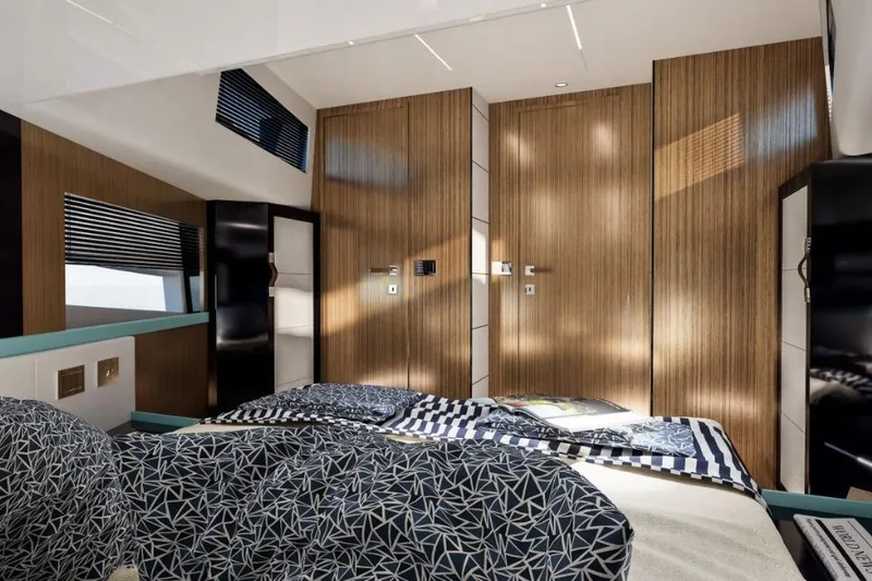  Yacht Photos Pics Luxurious cabin interior of 2025 Apreamare GOZZO 48, featuring modern design and elegant wood paneling.