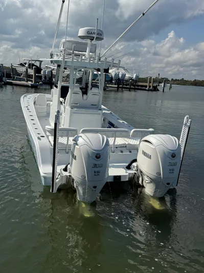  Yacht Photos Pics 2025 Freeman 28 boat with twin Yamaha 300 engines docked in calm waters.