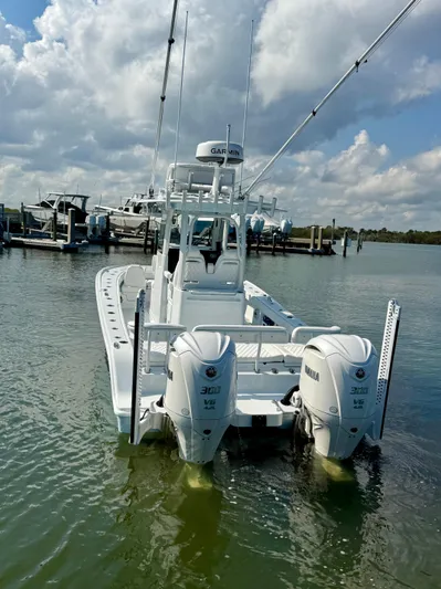  Yacht Photos Pics 2025 Freeman 28 boat with dual Yamaha engines docked in a marina.