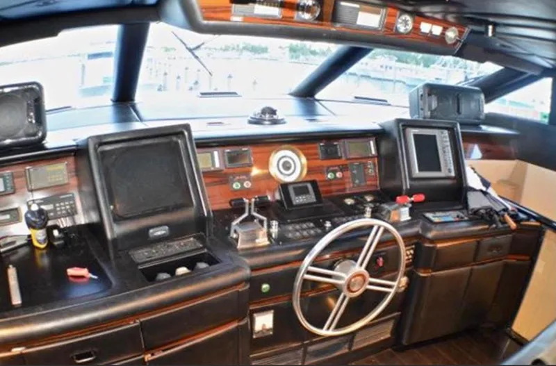 Audacity Yacht Photos Pics Pilothouse interior of 1990 Broward Raised Pilothouse MY yacht with navigation equipment.