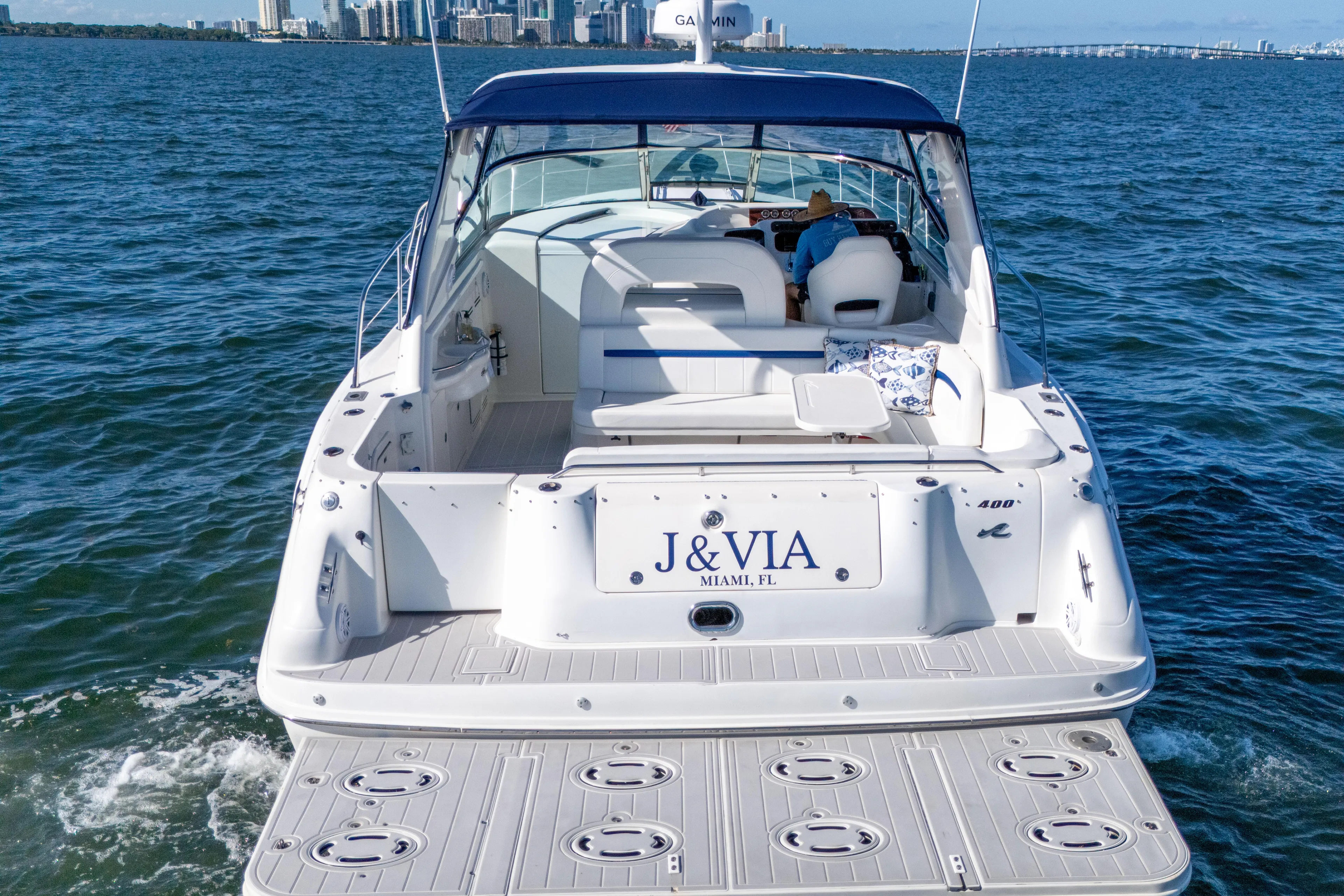  Yacht Photos Pics 1997 Sea Ray 400 Sundancer yacht cruising in Miami waters, rear view.