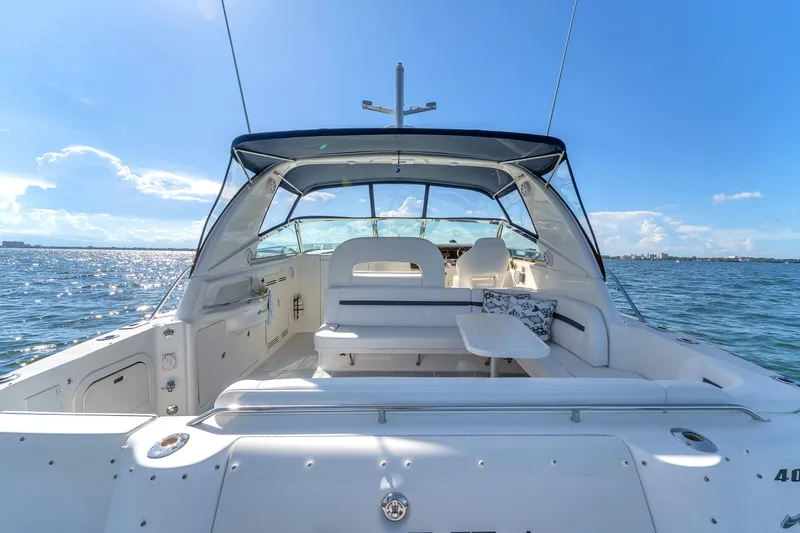  Yacht Photos Pics 1997 Sea Ray 400 Sundancer yacht interior with seating, table, and ocean view.