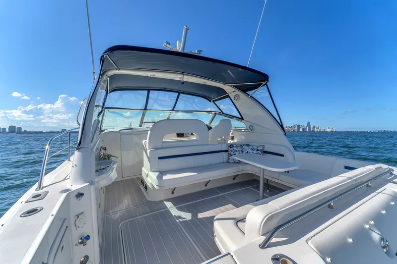  Yacht Photos Pics 1997 Sea Ray 400 Sundancer yacht interior with city skyline in background.