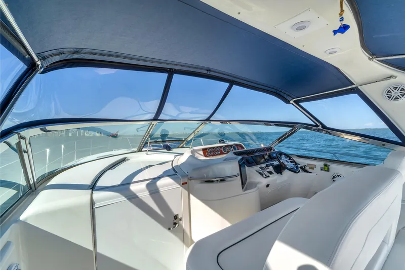  Yacht Photos Pics Interior view of 1997 Sea Ray 400 Sundancer yacht helm, overlooking ocean.