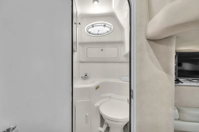  Yacht Photos Pics 1997 Sea Ray 400 Sundancer yacht bathroom with compact design and modern fixtures.