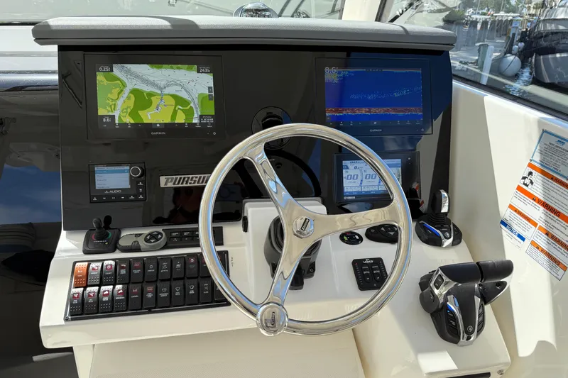 Centra Yacht Photos Pics 2023 Pursuit OS 355 Offshore helm with advanced navigation and control systems.