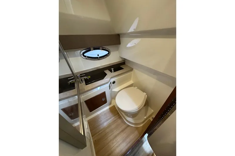  Yacht Photos Pics 2016 Formula 330 Crossover Bowrider bathroom with modern fixtures and wood flooring.