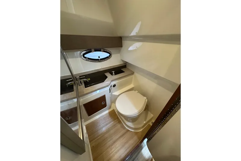  Yacht Photos Pics Interior of 2016 Formula 330 Crossover Bowrider bathroom with modern fixtures and wood flooring.