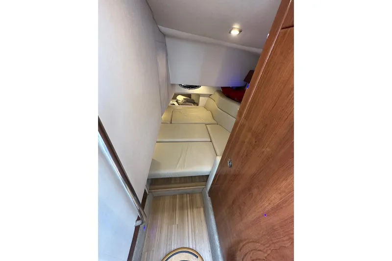  Yacht Photos Pics 2016 Formula 330 Crossover Bowrider cabin interior with cozy seating and wooden accents.