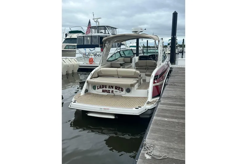  Yacht Photos Pics 2016 Formula 330 Crossover Bowrider docked, featuring spacious seating and elegant design.