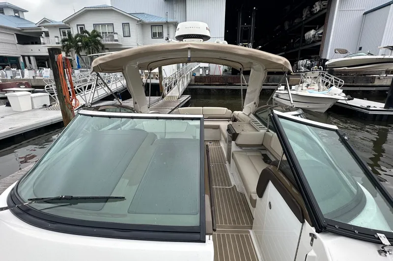  Yacht Photos Pics 2016 Formula 330 Crossover Bowrider docked at marina, showcasing spacious seating and sleek design.