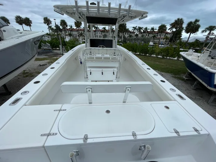  Yacht Photos Pics 2000 Venture 34 Tournament boat with spacious deck and seating, docked outdoors.