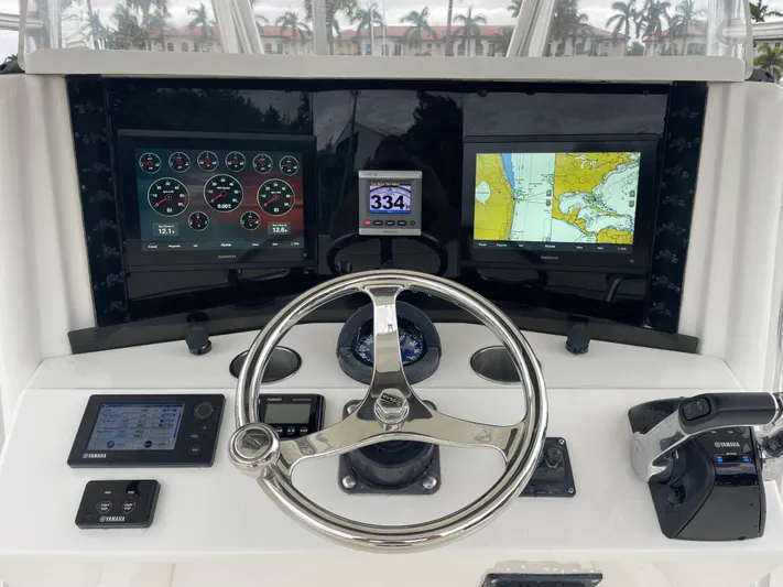  Yacht Photos Pics Boat dashboard with navigation screens and controls, Venture 34 Tournament, 2000 model.