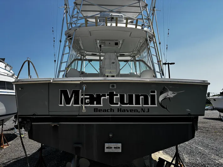Martuni Yacht Photos Pics 2002 Luhrs 40 Open boat named "Martuni" in Beach Haven, NJ, docked on land.