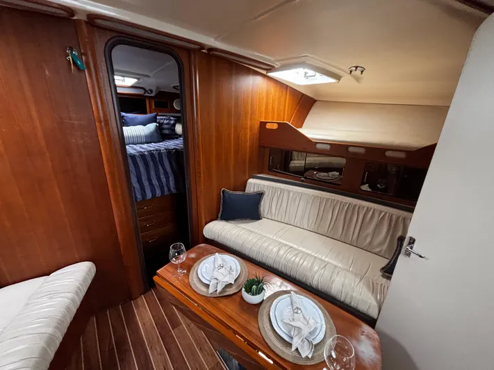 Martuni Yacht Photos Pics Interior of 2002 Luhrs 40 Open yacht with cozy seating and dining area.