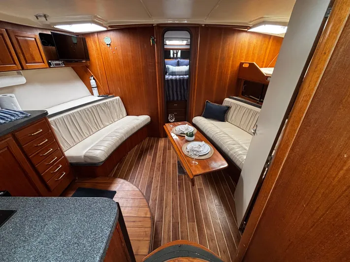 Martuni Yacht Photos Pics Luxurious 2002 Luhrs 40 Open yacht interior with elegant wood finish and cozy seating.