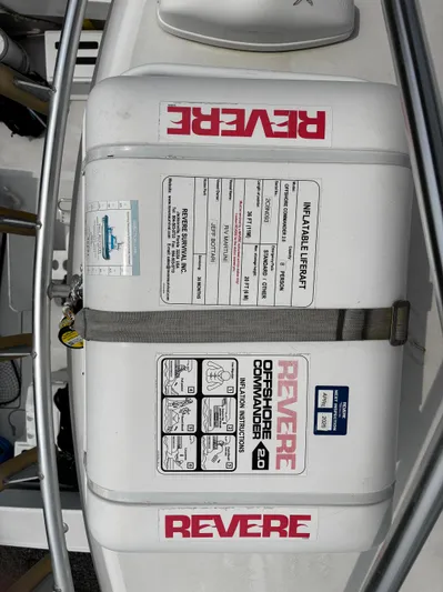 Martuni Yacht Photos Pics Life raft on 2002 Luhrs 40 Open boat, labeled "Revere Offshore Commander 2.0."