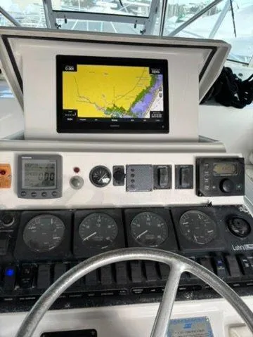 Martuni Yacht Photos Pics Control panel of a 2002 Luhrs 40 Open boat with navigation display.