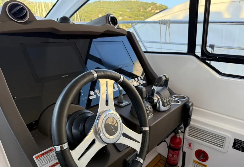  Yacht Photos Pics 2019 Azimut Atlantis 45 yacht cockpit with modern steering and navigation controls.
