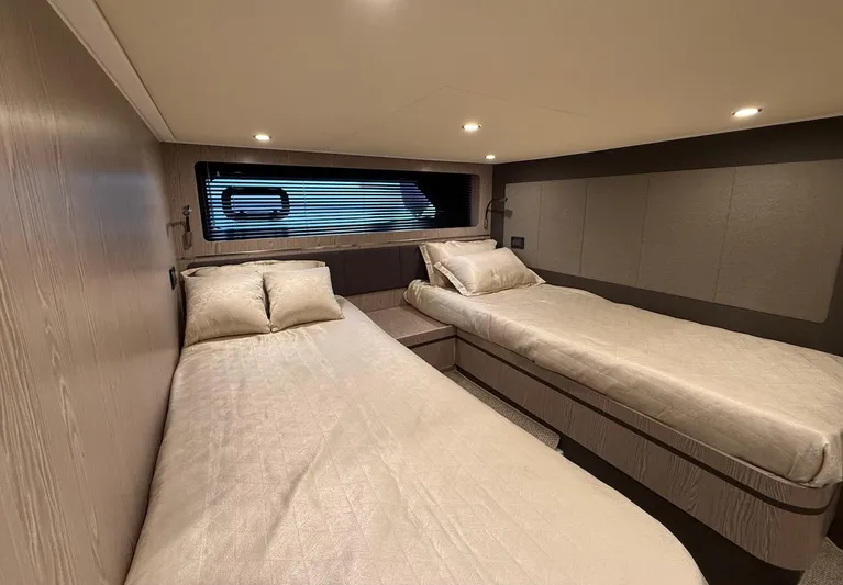  Yacht Photos Pics Twin beds in the 2019 Azimut Atlantis 45 yacht cabin, featuring modern design and cozy lighting.