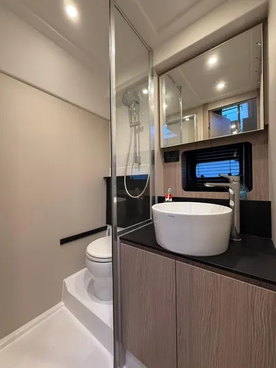  Yacht Photos Pics Luxurious bathroom in 2019 Azimut Atlantis 45 yacht with modern fixtures and elegant design.