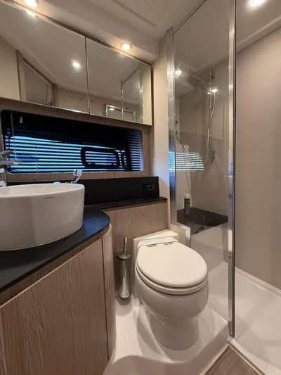  Yacht Photos Pics Luxurious bathroom in 2019 Azimut Atlantis 45 yacht with modern fixtures and shower.