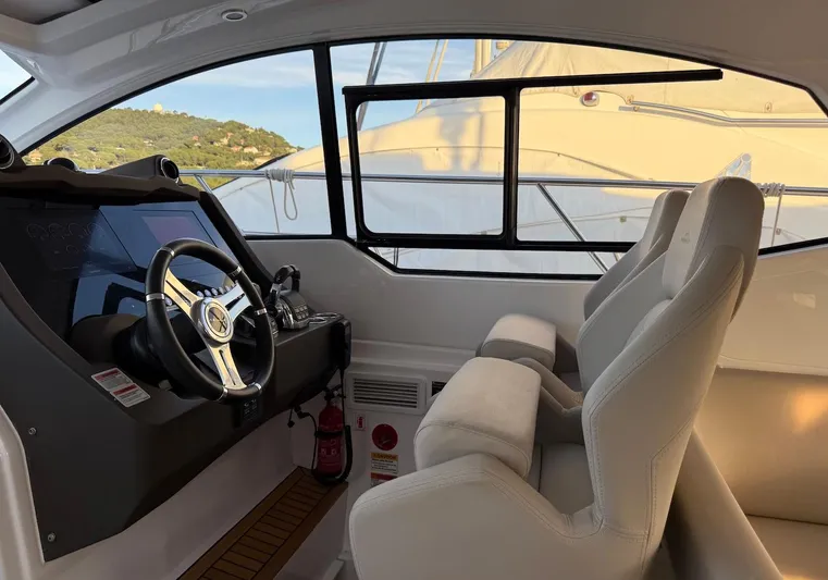  Yacht Photos Pics Interior cockpit of 2019 Azimut Atlantis 45 yacht with modern steering and seating.