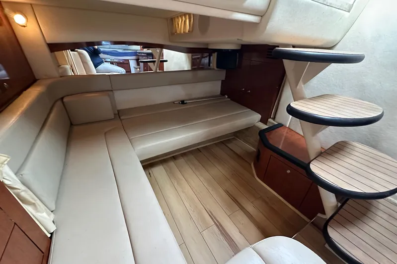  Yacht Photos Pics 2006 Sea Ray 340 Sundancer interior with beige seating and wooden steps.