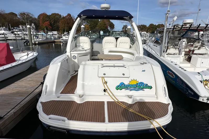  Yacht Photos Pics 2006 Sea Ray 340 Sundancer docked, featuring spacious deck and "Eternal Bliss" name.