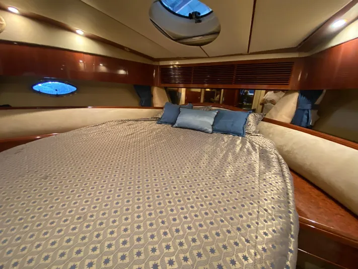  Yacht Photos Pics Luxurious cabin interior of 2001 Fairline Squadron 55 yacht with elegant bedding.