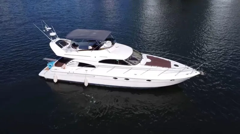  Yacht Photos Pics 2001 Fairline Squadron 55 yacht cruising on calm waters.