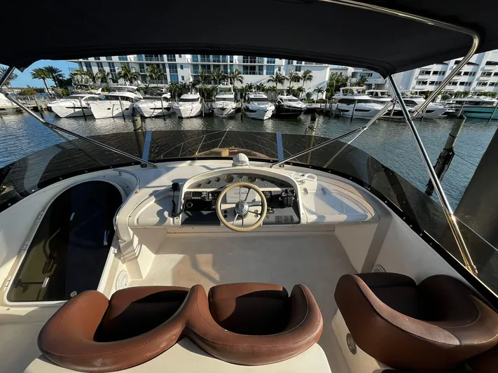  Yacht Photos Pics Flybridge of 2001 Fairline Squadron 55 yacht with marina view.