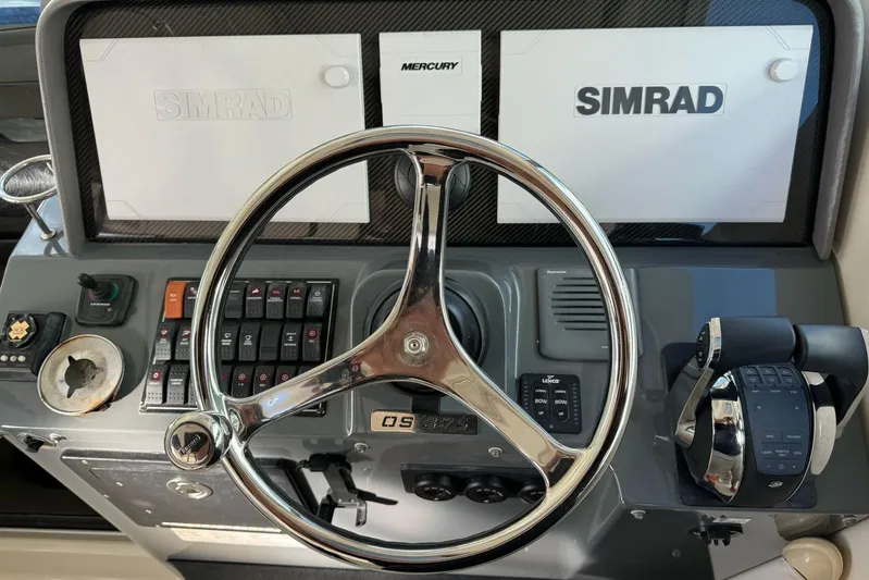  Yacht Photos Pics 2009 Pursuit OS 375 Offshore helm with Simrad electronics and Mercury controls.