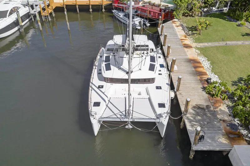 Yacht Photos Pics Aerial view of 2019 Lagoon 450 F catamaran docked at marina.