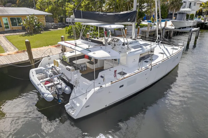  Yacht Photos Pics 2019 Lagoon 450 F catamaran docked, featuring spacious deck and modern design.