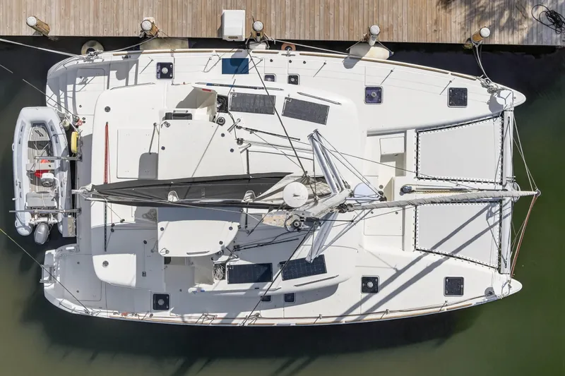  Yacht Photos Pics Overhead view of a 2019 Lagoon 450 F catamaran docked at a marina.
