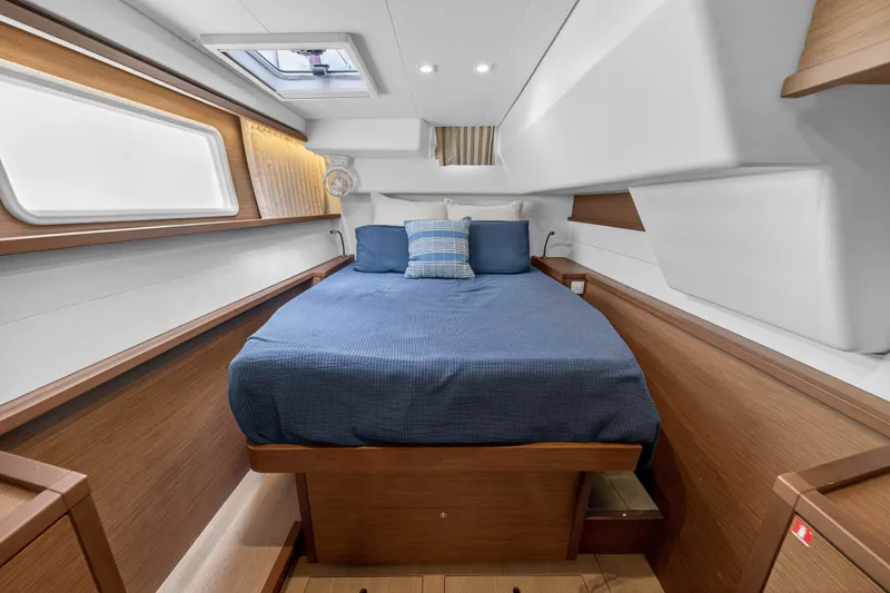  Yacht Photos Pics Luxurious cabin interior of 2019 Lagoon 450 F yacht with cozy bed and modern design.