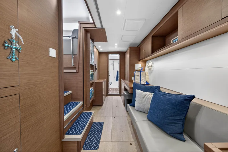  Yacht Photos Pics Luxurious interior of 2019 Lagoon 450 F yacht with modern wood finish and blue accents.