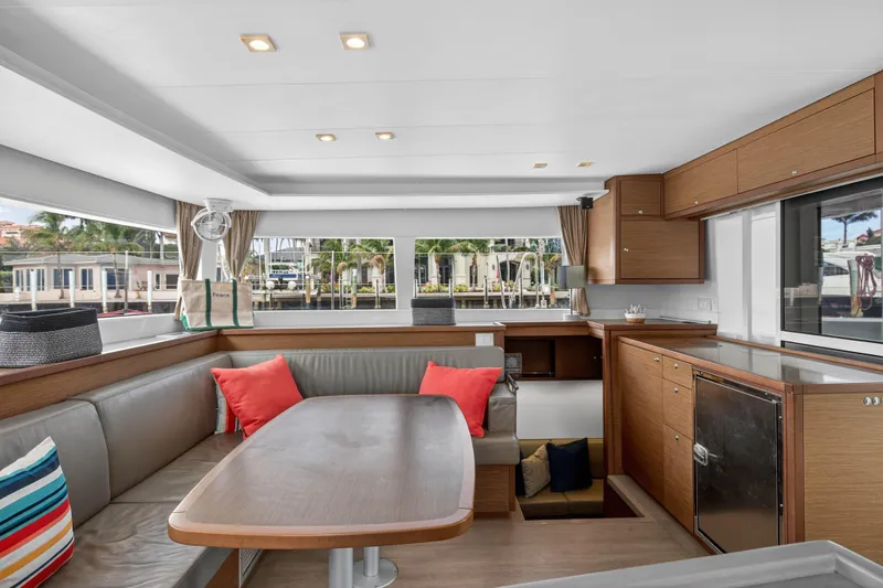  Yacht Photos Pics Luxurious interior of 2019 Lagoon 450 F catamaran with modern seating and cabinetry.