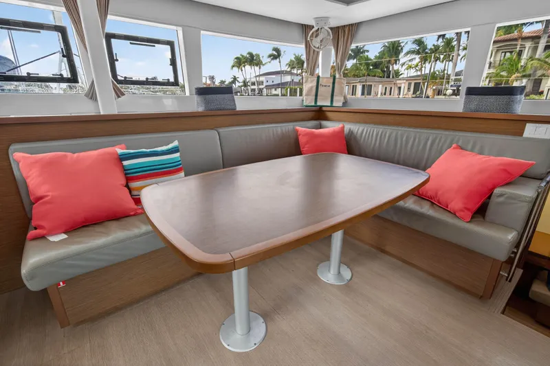  Yacht Photos Pics Interior of 2019 Lagoon 450 F yacht with cozy seating and colorful cushions.