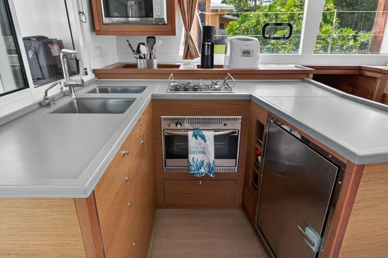  Yacht Photos Pics Modern kitchen in a 2019 Lagoon 450 F yacht with sleek countertops and appliances.