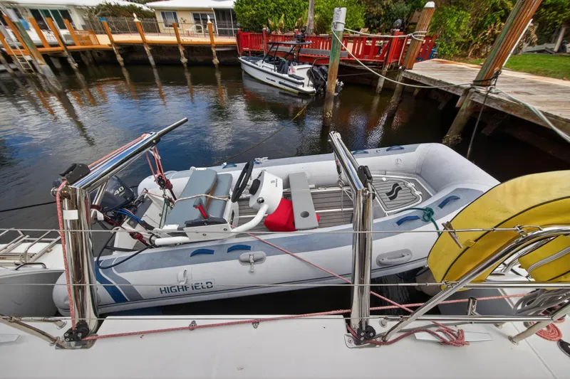  Yacht Photos Pics Inflatable boat docked beside a 2019 Lagoon 450 F catamaran.