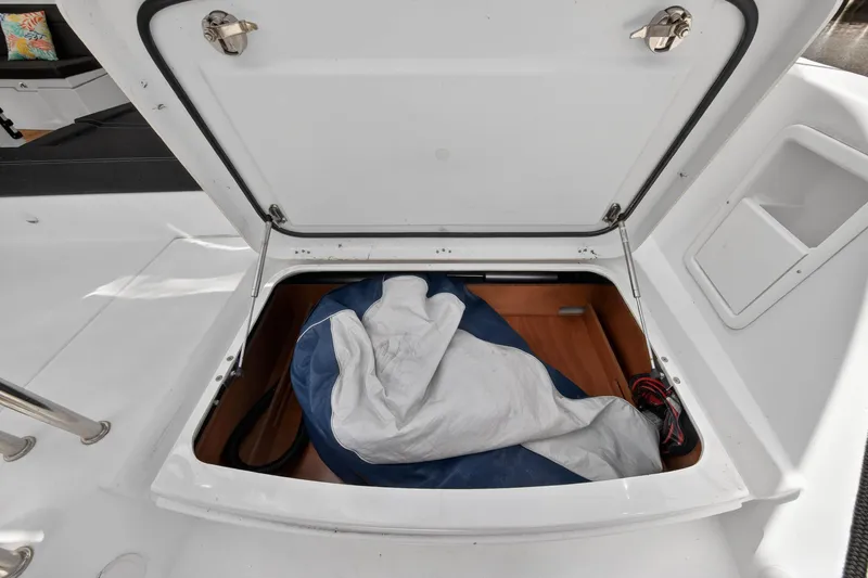  Yacht Photos Pics Open storage compartment on 2019 Lagoon 450 F yacht, containing a folded sail.