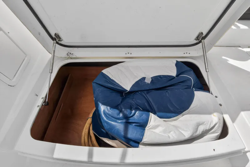  Yacht Photos Pics Open storage compartment on 2019 Lagoon 450 F yacht with blue and white sail.